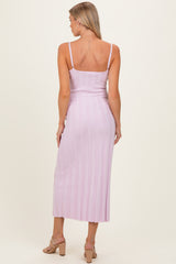 woman wearing a light purple ribbed maternity dress with thin straps and a fitted silhouette