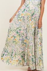 woman wearing a flowy floral pleated maternity maxi skirt with colorful patterns and a comfortable fit