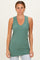 woman wearing a green ribbed sleeveless tunic top with a v-neckline and fitted silhouette