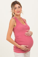 woman wearing a dusty rose maternity tank top and holding her baby bump