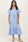woman wearing a blue and white striped midi dress with short sleeves and a drawstring waist.