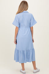 woman wearing a blue and white striped maternity dress with short sleeves and a flounce hem