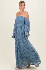 woman wearing a blue off-the-shoulder lace maxi dress with long bell sleeves
