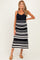 woman wearing a navy blue and white striped maternity dress with adjustable straps and midi length