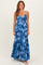 woman wearing a blue tie-dye maxi dress with a keyhole detail and tiered ruffles