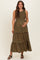 woman wearing a black floral maternity maxi dress with tiered ruffles and holding her baby bump