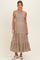 woman wearing a floral print sleeveless maxi maternity dress with a tiered skirt and a baby bump visible