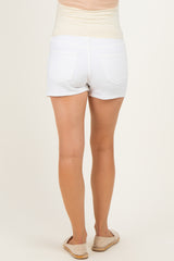 woman wearing white maternity shorts with a supportive waistband, showing a smooth back view and casual style