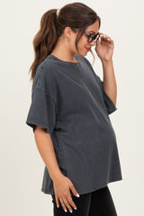 woman wearing a charcoal oversized maternity t-shirt with a visible baby bump and glasses