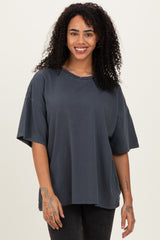 woman wearing a dark gray oversized t-shirt with short sleeves and a relaxed fit