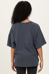 woman wearing a charcoal oversized short sleeve t-shirt seen from the back