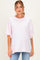 woman wearing a light pink oversized maternity t-shirt with short sleeves and a relaxed fit
