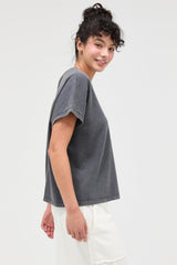 woman wearing a gray short sleeve relaxed fit t-shirt with a round neckline
