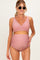 woman wearing a blush pink maternity bikini set with a wrap top and high-waisted bottoms, showing her baby bump