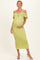 woman wearing a light green off-the-shoulder maternity dress with a fitted silhouette and a baby bump