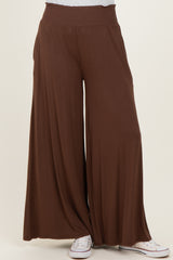 wide leg brown palazzo pants with a smocked waistband, styled with white sneakers