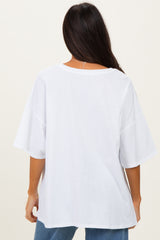 woman wearing a white oversized t-shirt with short sleeves and a relaxed fit, viewed from the back