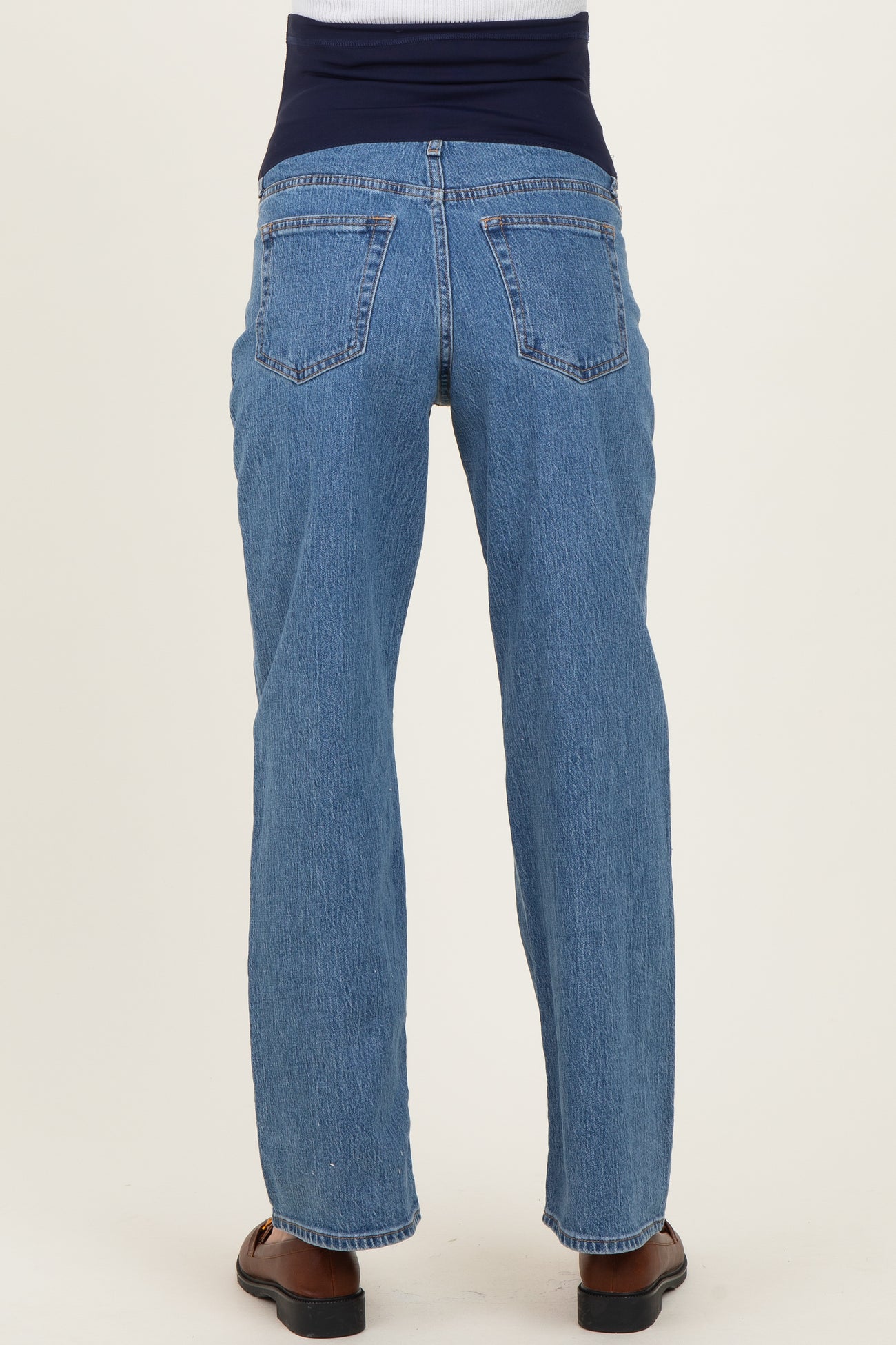 maternity wear blue straight leg jeans with a stretchy dark blue waistband, shown from the back