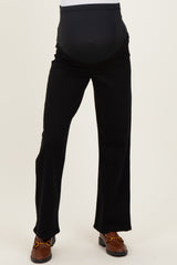woman wearing black maternity pants with an over-the-bump waistband