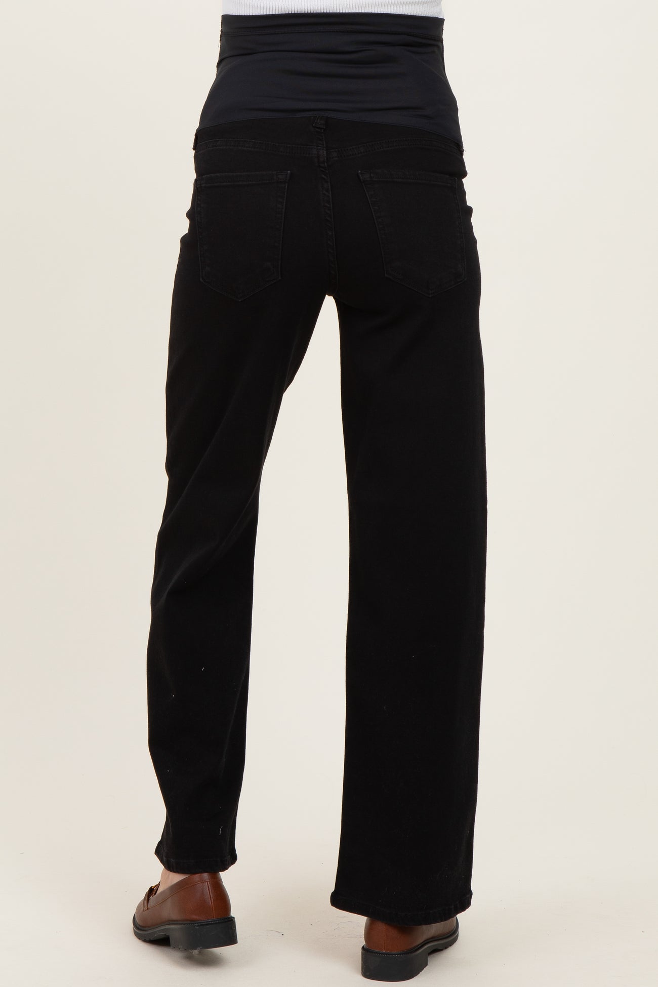black maternity jeans with a stretchy waistband, shown from the back, featuring a relaxed fit and wide leg style