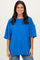 woman wearing a bright blue oversized t-shirt with wide sleeves and a relaxed fit