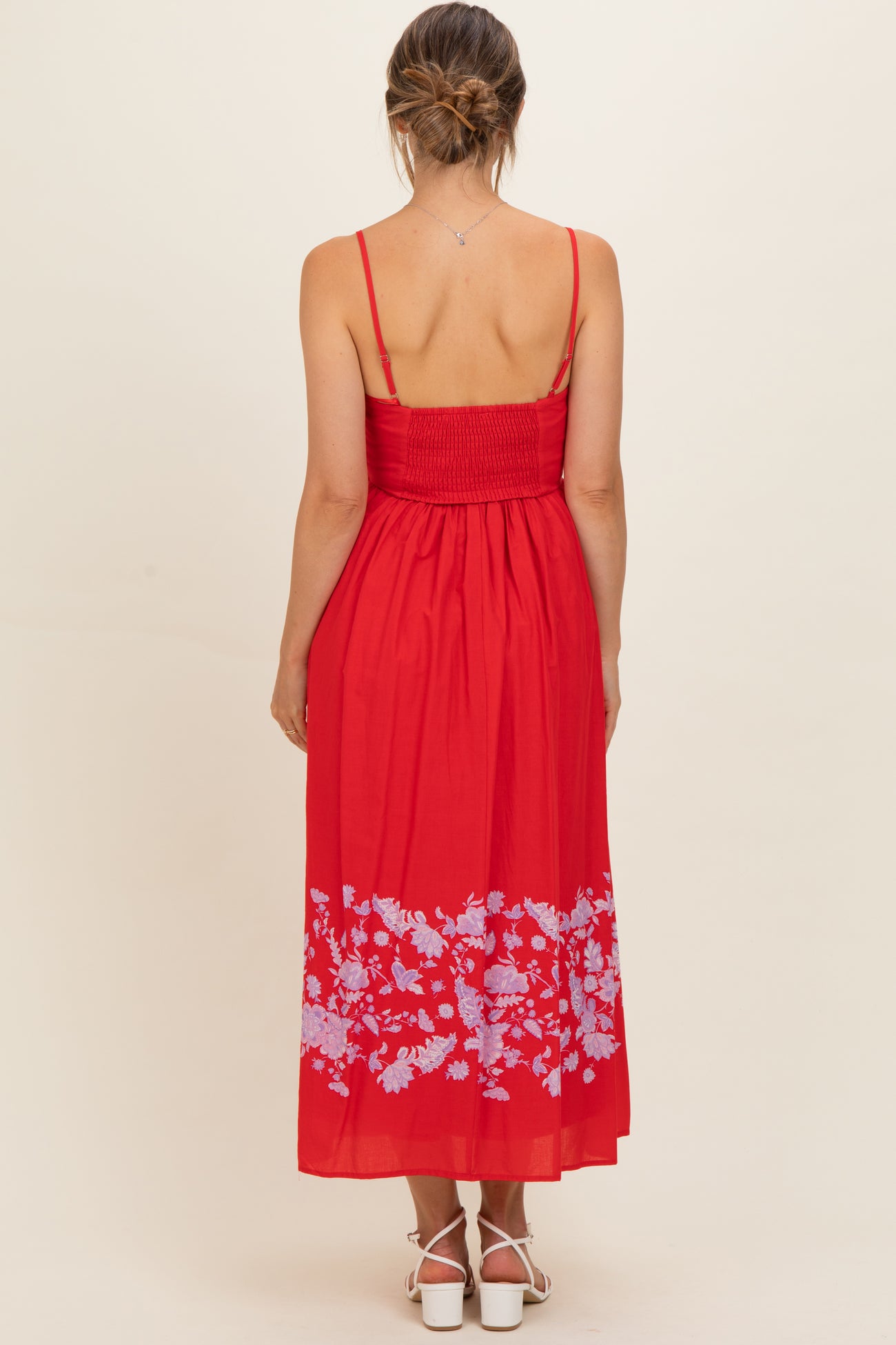 maternity wear red maxi dress with spaghetti straps and floral embroidery on the hem, showing the back view