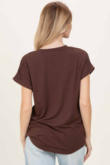 woman wearing a brown short sleeve top, viewed from the back, paired with light blue jeans