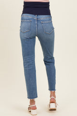 maternity wear light blue skinny jeans with a frayed hem, shown from the back on a model wearing a fitted top