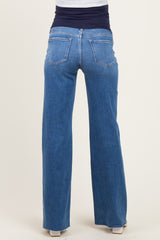 woman wearing blue maternity jeans with a comfortable waistband, showing the back view