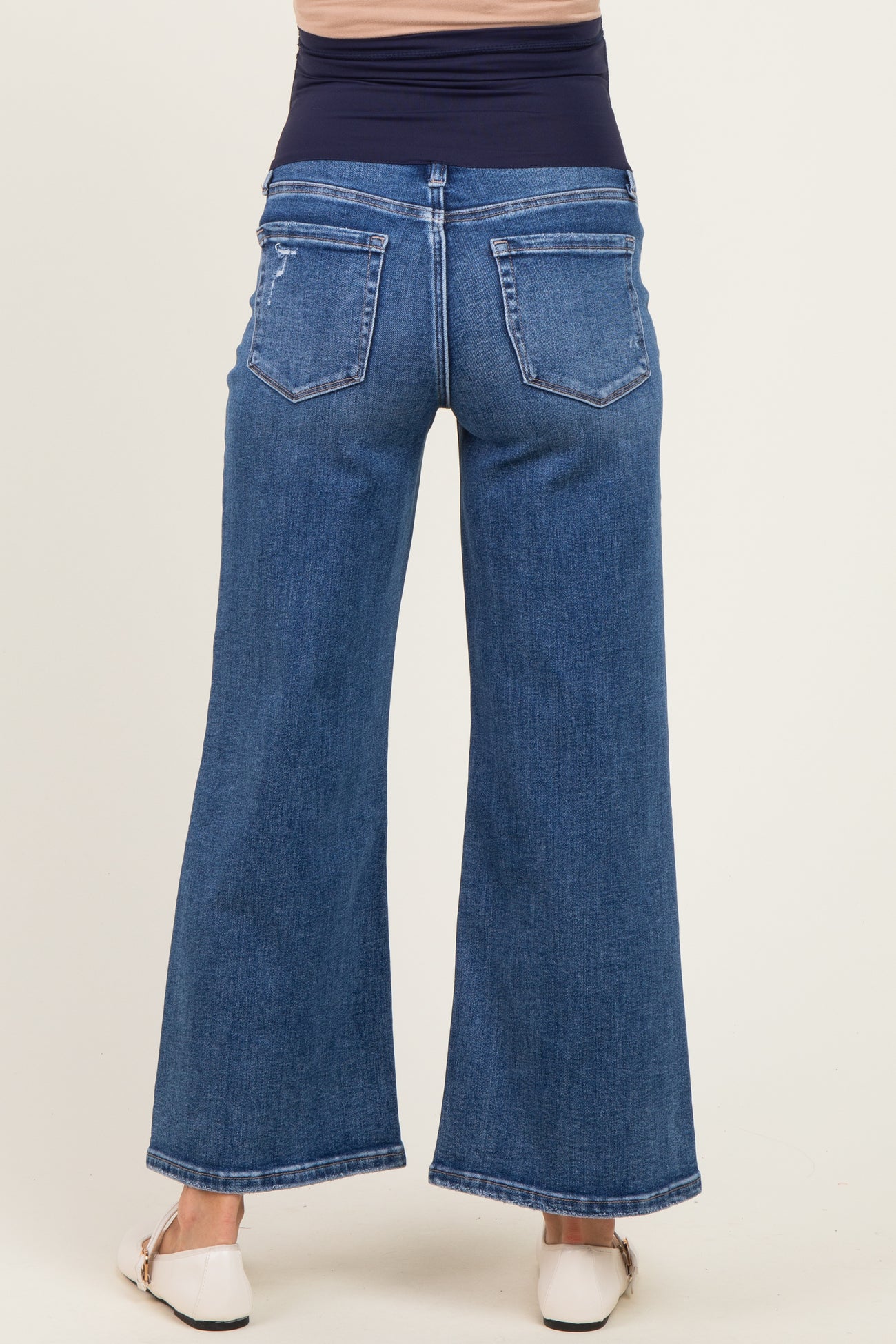 maternity wear wide leg dark blue jeans with a stretchy waistband, shown from the back