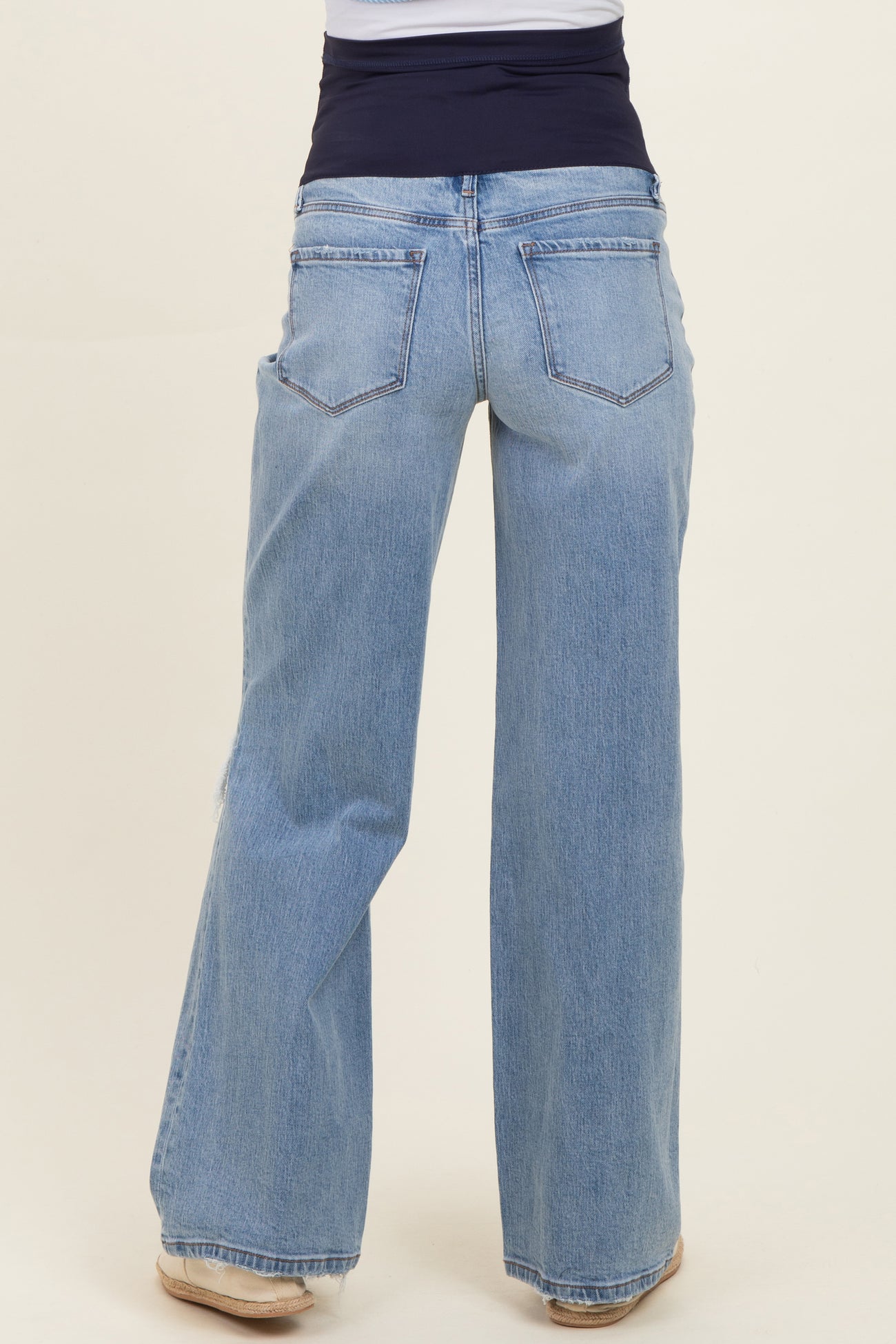 maternity wear light wash wide-leg jeans with a comfortable stretchy waistband