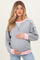 woman wearing a gray maternity sweatshirt with pink accents and holding her baby bump