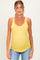 woman wearing a bright yellow maternity tank top with button details and a visible baby bump
