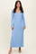 woman wearing a light blue long sleeve ribbed maxi dress with a tie waist detail