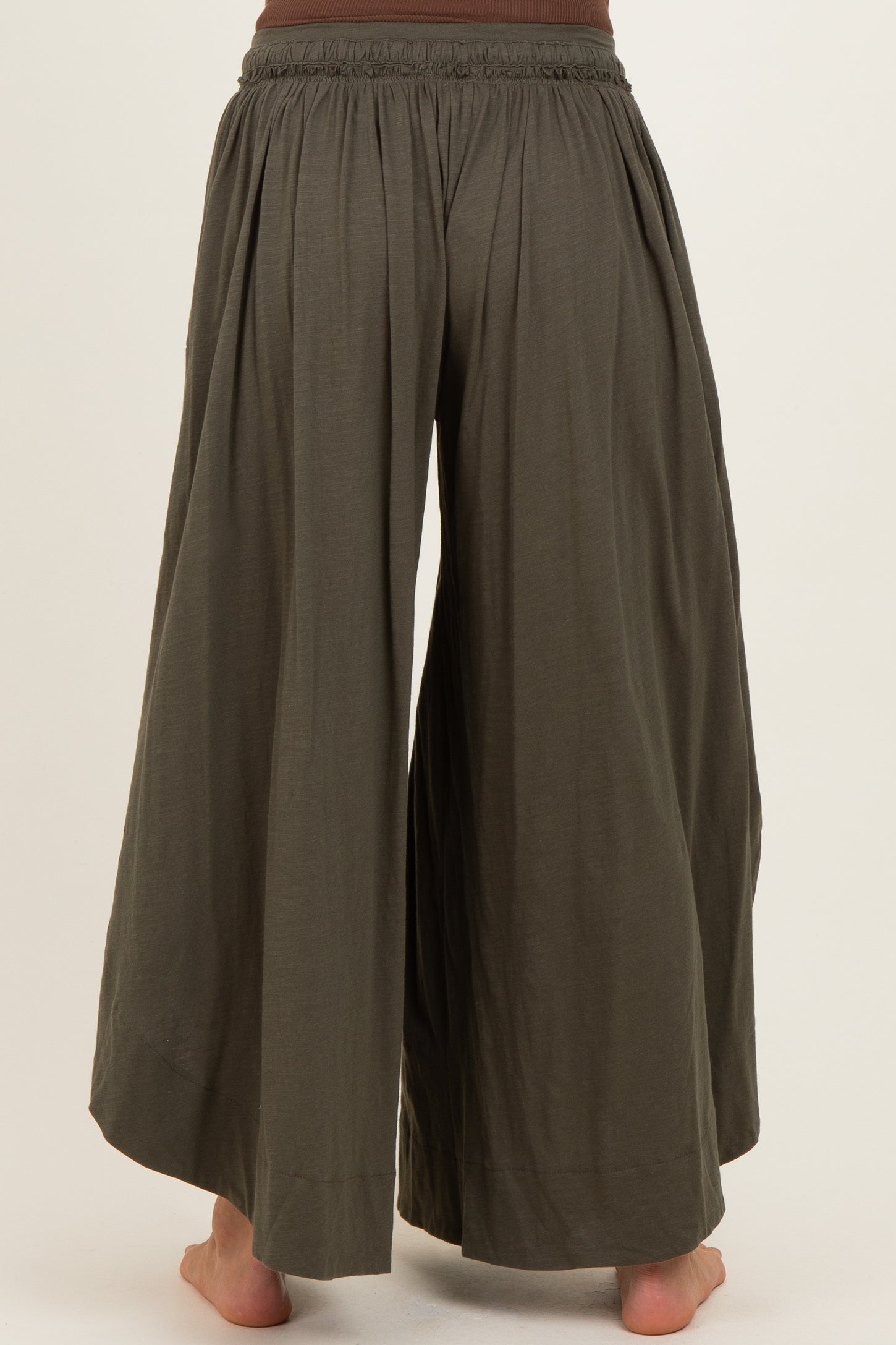 woman wearing olive green maternity wide-leg pants with an elastic waistband, shown from the back