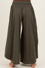 woman wearing olive green maternity wide-leg pants with an elastic waistband, shown from the back