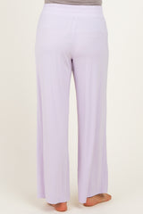 woman wearing light purple maternity wide-leg pants seen from the back