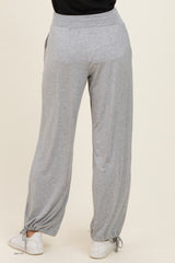 woman wearing gray relaxed fit lounge pants with drawstring and elastic waistband