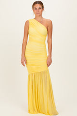 woman wearing a yellow one-shoulder ruched formal dress with a flowing skirt