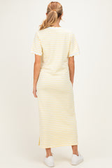woman wearing a yellow and white striped maternity maxi dress, short sleeves, viewed from the back