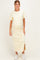 woman wearing a yellow and white striped maternity maxi dress with short sleeves and a side slit, showing her baby bump