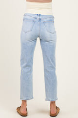 woman wearing light wash maternity jeans with a stretchy waistband, showing the back view
