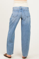 woman wearing light blue maternity jeans with a relaxed fit, shown from the back