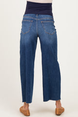 woman wearing indigo maternity jeans with a wide-leg cut and a stretchy waistband, showing the back view