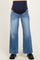 woman wearing blue maternity wide-leg jeans with a dark blue over-the-bump waistband