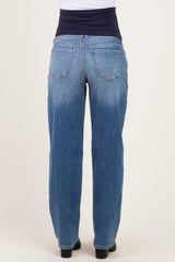 woman wearing light blue maternity jeans with a navy blue waistband, shown from the back