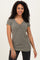 woman wearing a short sleeve olive green ribbed top with a v-neck and fitted silhouette