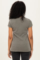 woman wearing a grey ribbed short sleeve top, viewed from the back, paired with black jeans