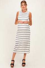woman wearing a striped sleeveless maternity dress that highlights her baby bump