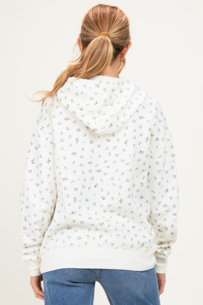 woman wearing a white floral print maternity hoodie with a hoodie and soft fabric